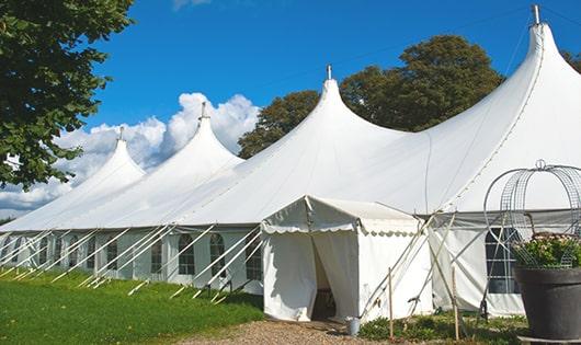 a line of sleek and modern porta potties ready for use at an upscale corporate event in Wilton